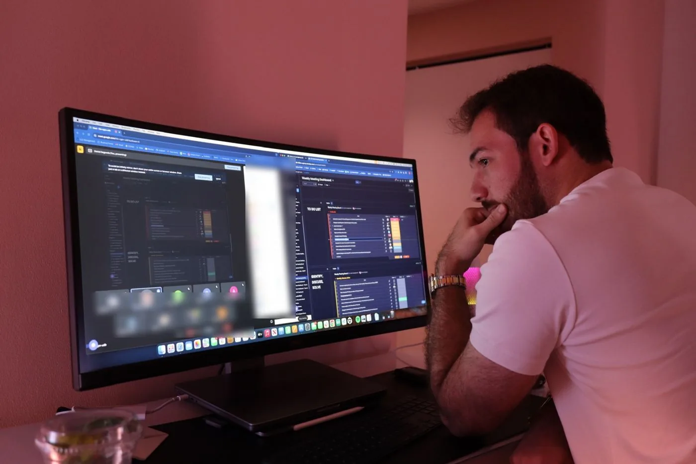 Daniel Segurola running the weekly numbers on a wall of dashboards